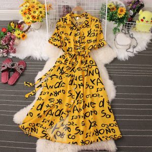 Сукня-сорочка з коротким рукавом жовта в чорний принт